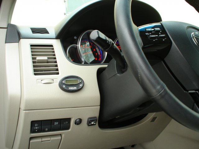 Кнопка переключения и индикации режимов работы ГБО в салоне Mazda CX-9